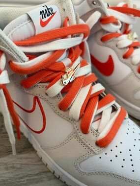 Nike White & Orange High-Top Sneakers with Gold Swoosh Charm